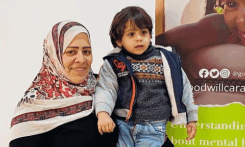 Palestinian refugee mother holding her child at Goodwill Caravan's Sallam Centre in Cairo 